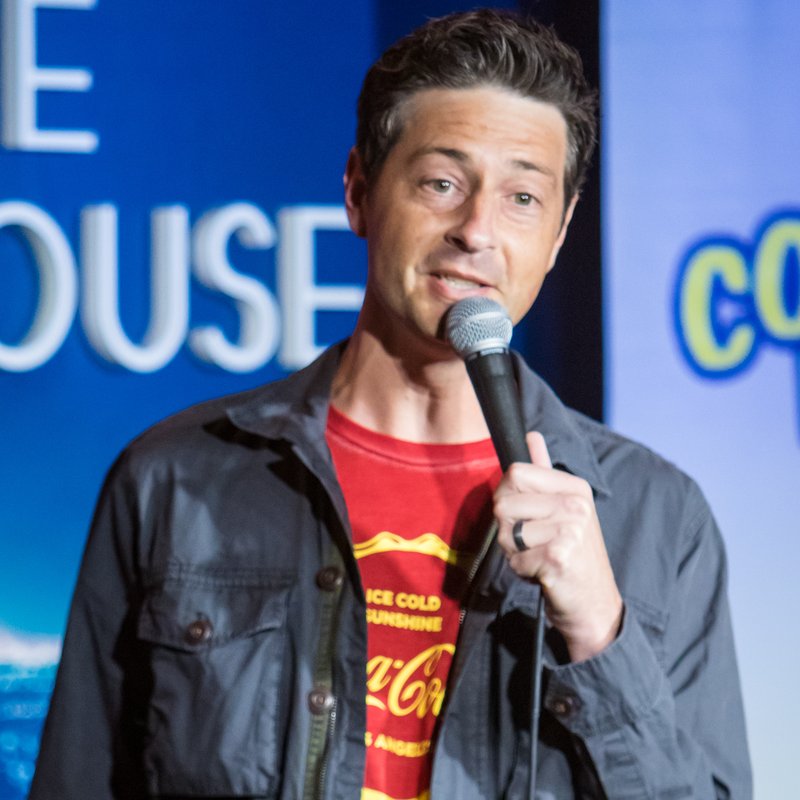 Brandon Vestal on stage at a Cool Beans Comedy show.
