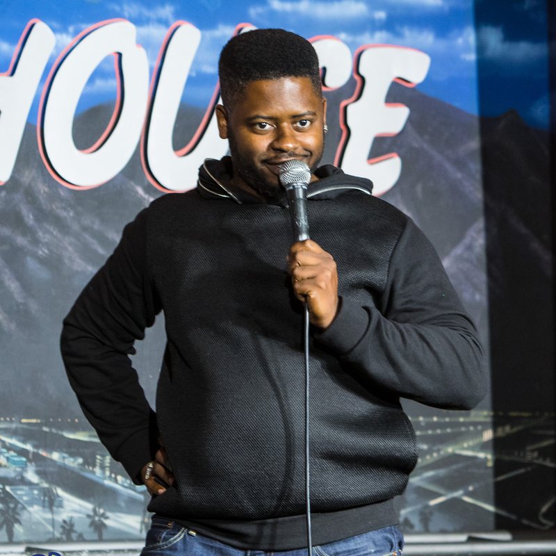 BT Kingsley on stage at a Cool Beans Comedy show.