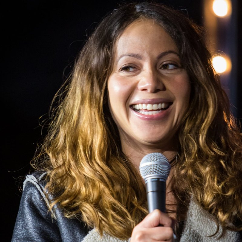 Candice Thompson on stage at a Cool Beans Comedy show.