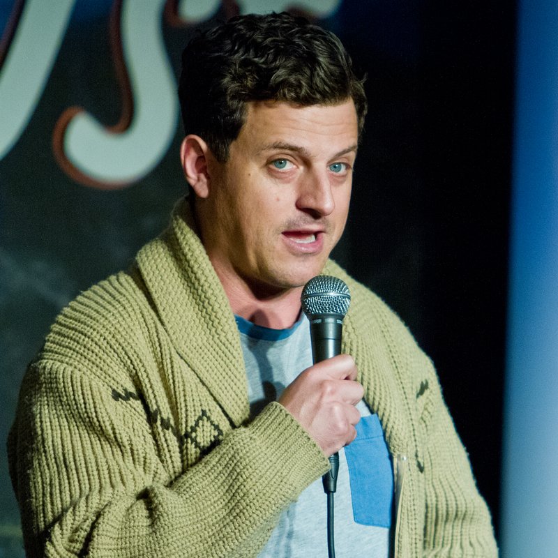 Chris Fairbanks on stage at a Cool Beans Comedy show.