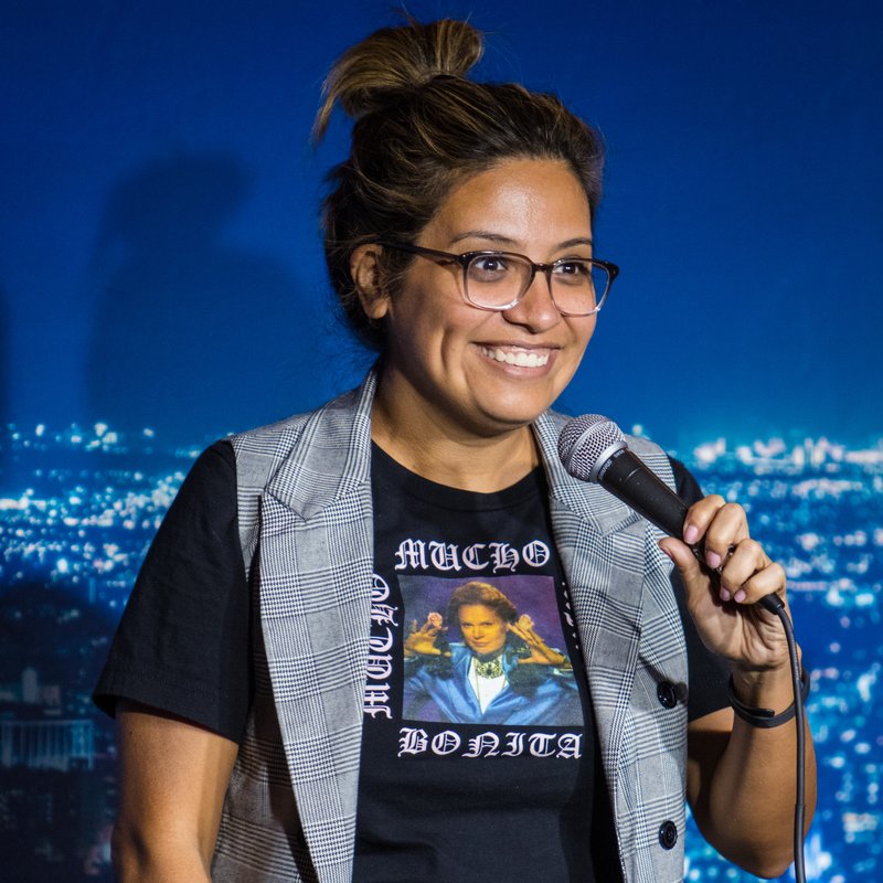 Cristela Alonzo on stage at a Cool Beans Comedy show.