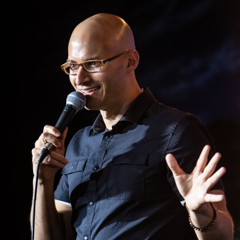 Eric Schwartz on stage at a Cool Beans Comedy show.