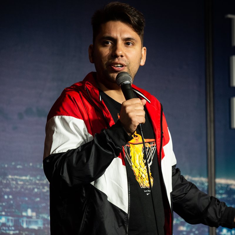 Fabrizio Copano on stage at a Cool Beans Comedy show.