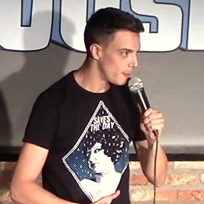 Hampton Yount on stage at a Cool Beans Comedy show.