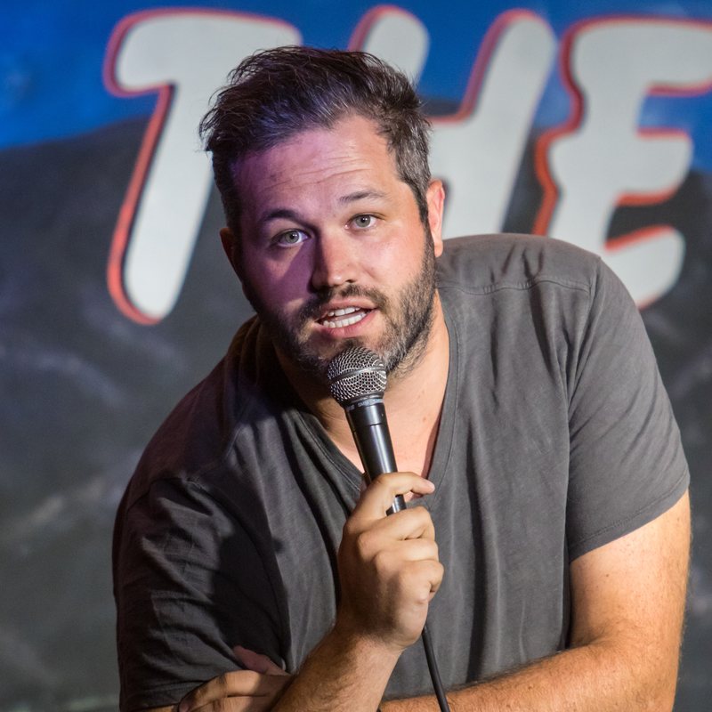 Hunter Hill on stage at a Cool Beans Comedy show.