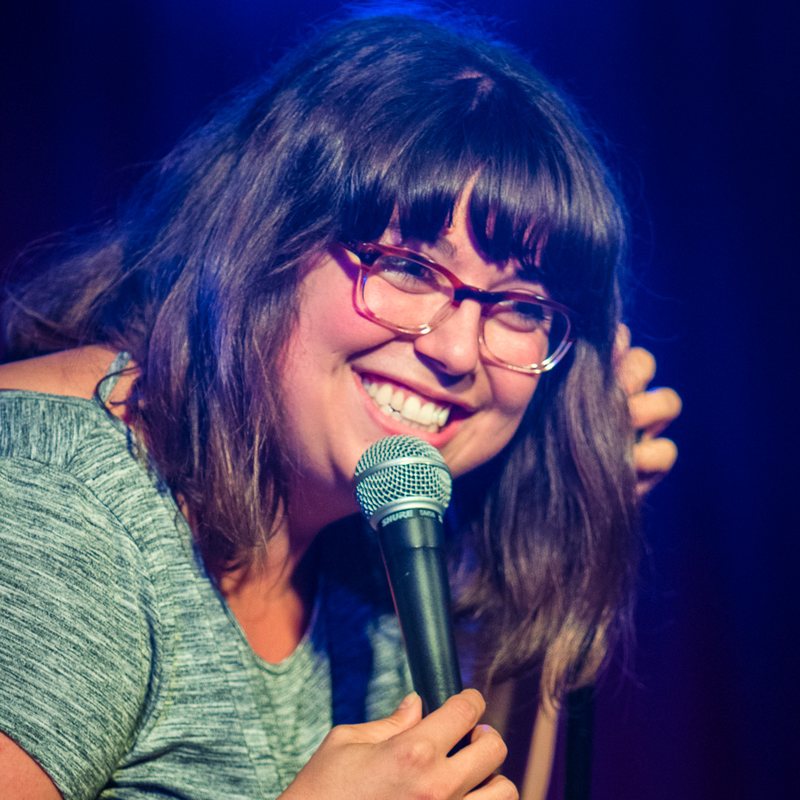 Jenny Zigrino on stage at a Cool Beans Comedy show.