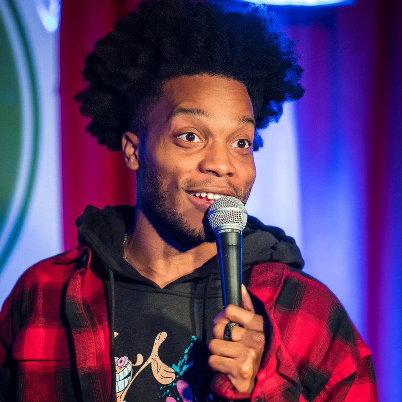 Jermaine Fowler on stage at a Cool Beans Comedy show.