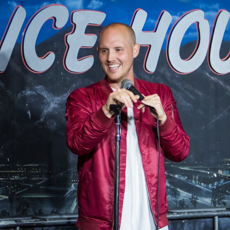 Kane Holloway on stage at a Cool Beans Comedy show.