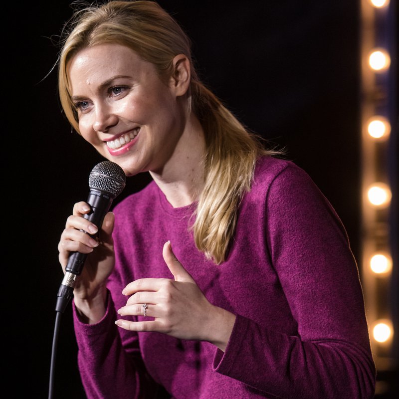 Kelsey Cook on stage at a Cool Beans Comedy show.