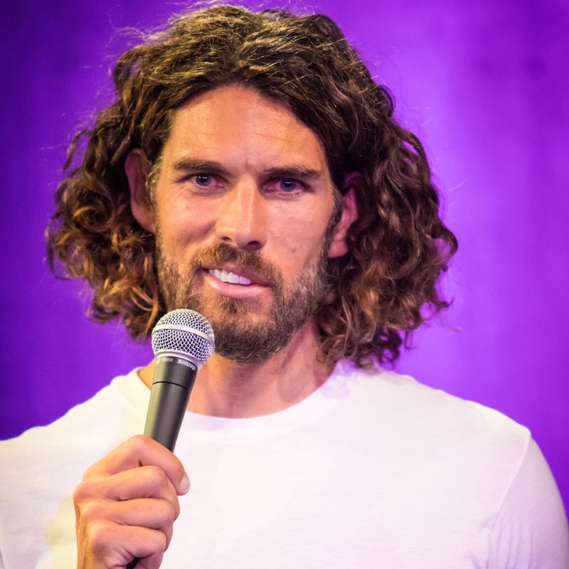 Lachlan Patterson on stage at a Cool Beans Comedy show.
