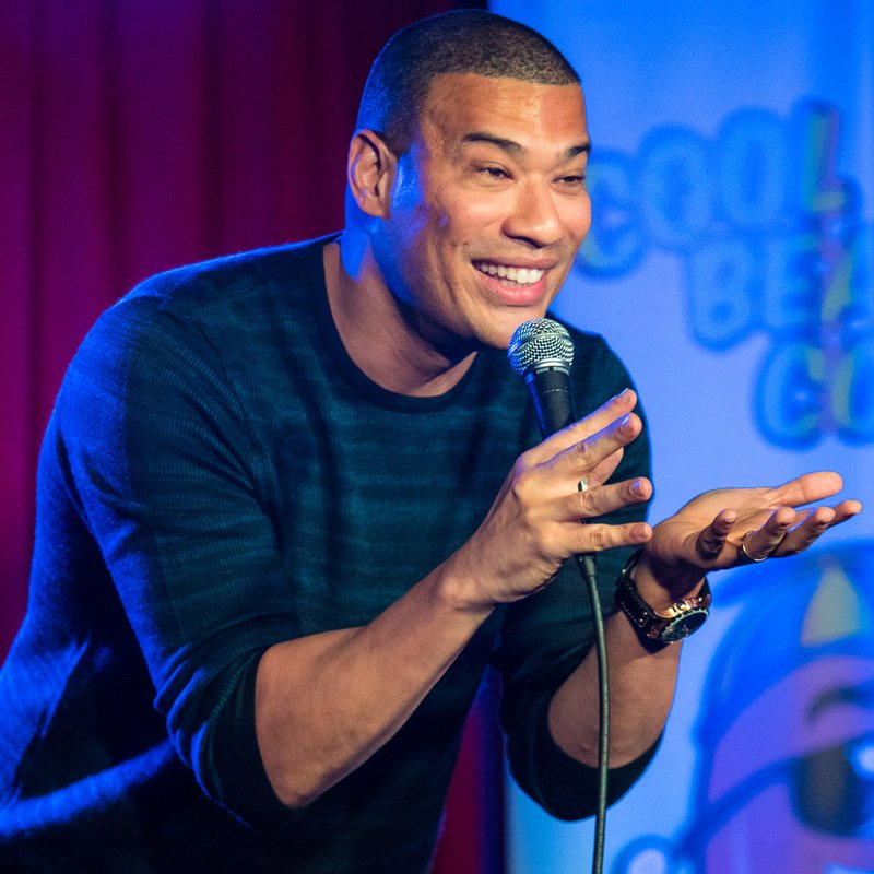 Michael Yo on stage at a Cool Beans Comedy show.