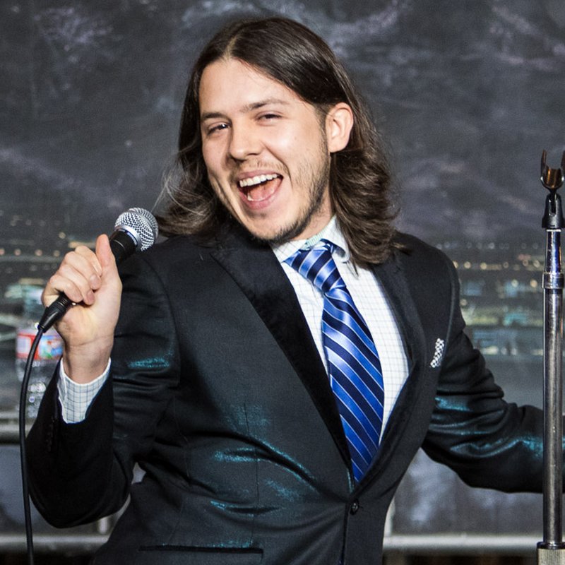 Nick Guerra on stage at a Cool Beans Comedy show.