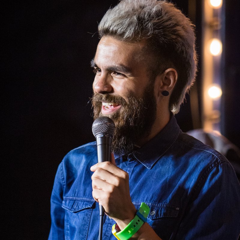 Rojo Perez on stage at a Cool Beans Comedy show.