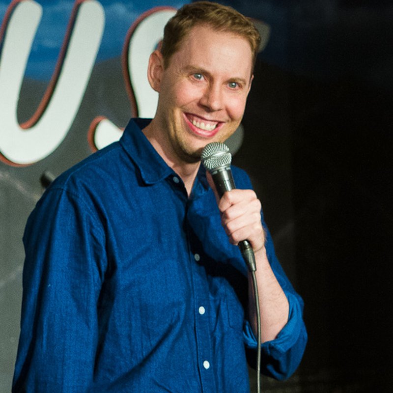 Ryan Hamilton on stage at a Cool Beans Comedy show.