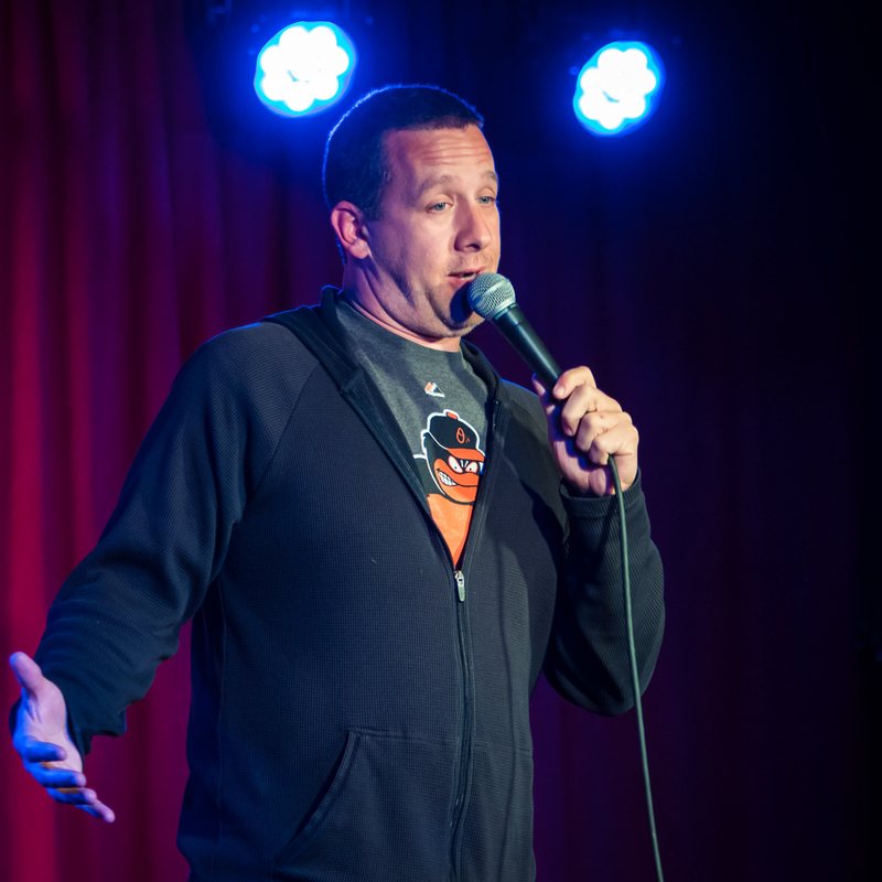 Ryan Sickler on stage at a Cool Beans Comedy show.