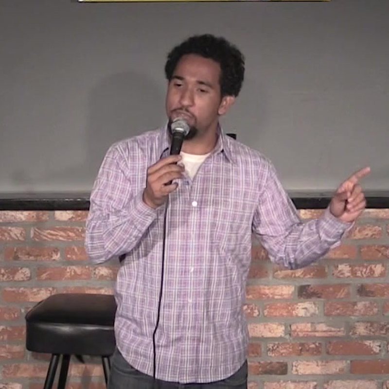 Sean Grant on stage at a Cool Beans Comedy show.