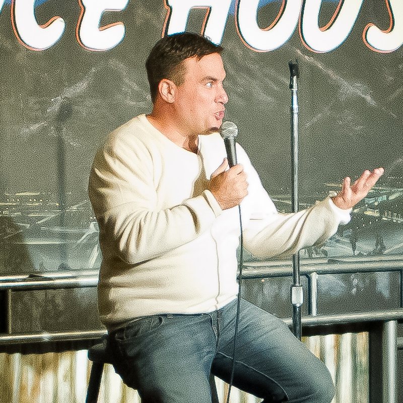 Steve Simeone on stage at a Cool Beans Comedy show.