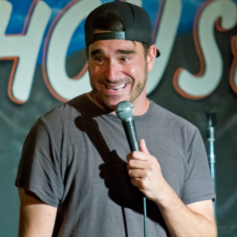 Thomas Dale on stage at a Cool Beans Comedy show.
