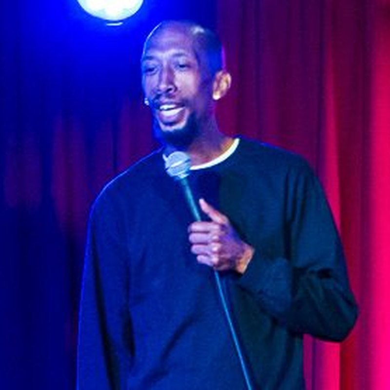 Tobe Hixx on stage at a Cool Beans Comedy show.