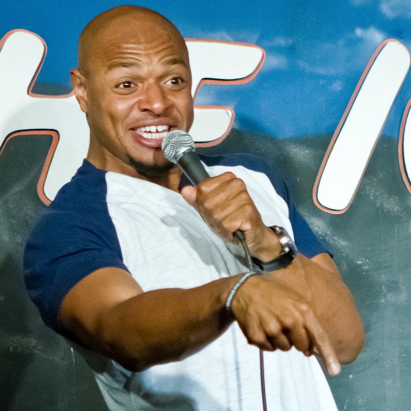 Tony Baker on stage at a Cool Beans Comedy show.