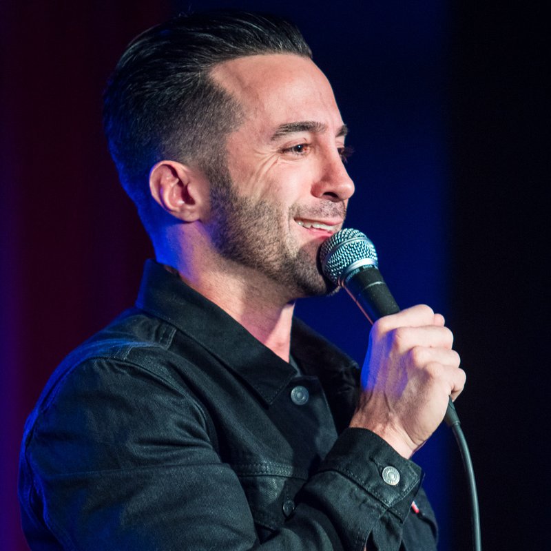 Vincent Oshana on stage at a Cool Beans Comedy show.